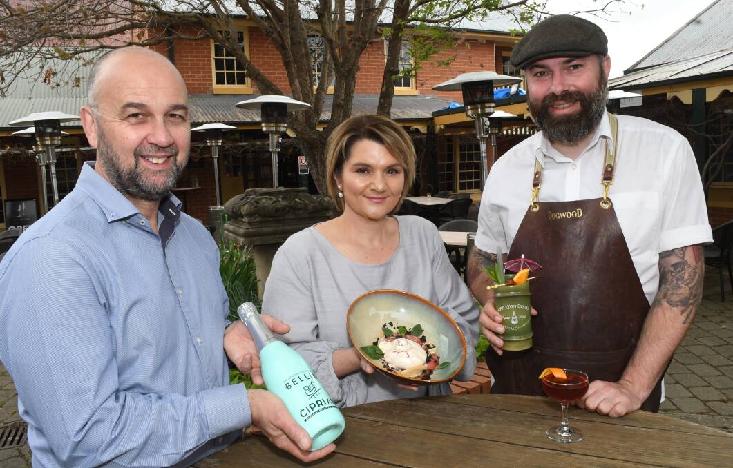 GREAT TASTE: Vine & Tap owners Stephen Swart and Trish Marino, with Dogwood owner Evan Stanley celebrating their listings in the latest Good Food Guide. Photo: CHRIS SEABROOK 101418cgoodfood