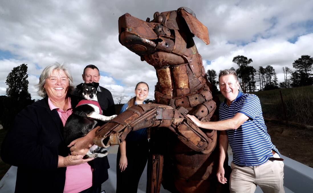 BIG DOG: Sculptor Jane Tyack and her husband Shane Howarth with their dog Gem, and Dunkeld Park Pet Hotel's Annabelle and her father Brendan McHugh with the recently-installed Big Dog sculpture. Photo: PHIL BLATCH