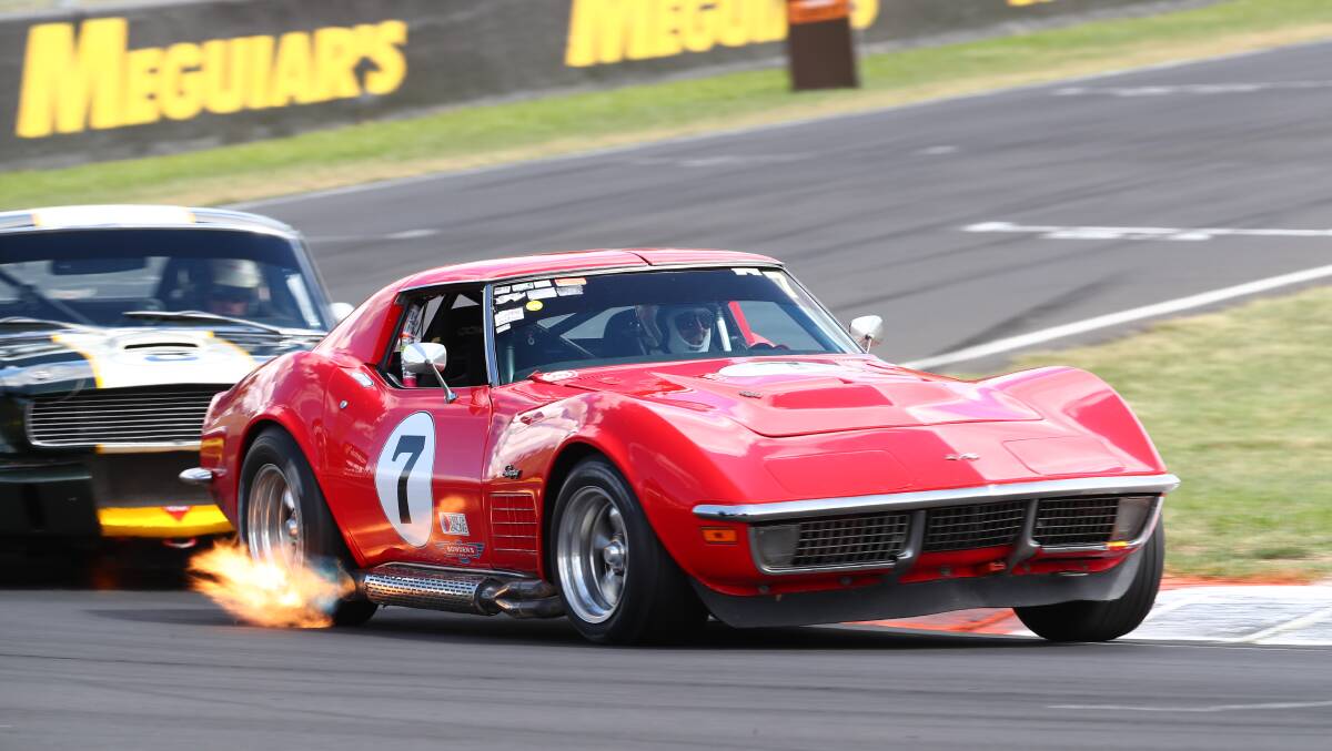 SNAPSHOT: Paul Blackey in his flaming red Corvette during the Bathurst 12 Hour race festival at Mount Panorama. Photo: PHIL BLATCH 020318pbsnap1