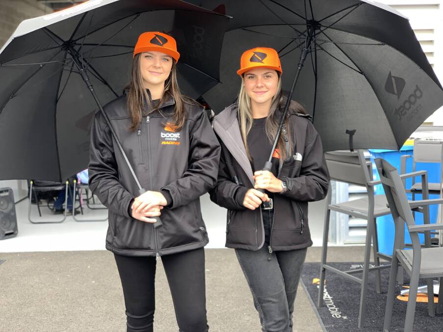 TEAM EFFORT: Sisters Ashley and Emily Chebaia are working as promo girls for the Boost Mobile Racing team at the Bathurst 1000 this weekend. Photo: NADINE MORTON 101219nmpromo