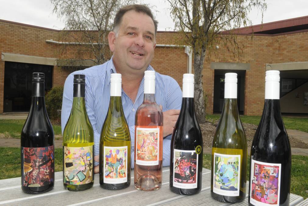BOUTIQUE DROPS: Charles Sturt University food and beverage manager Brett Russell with a selection of the university's wines that will be available to try. Photo: CHRIS SEABROOK 100317csuwine1