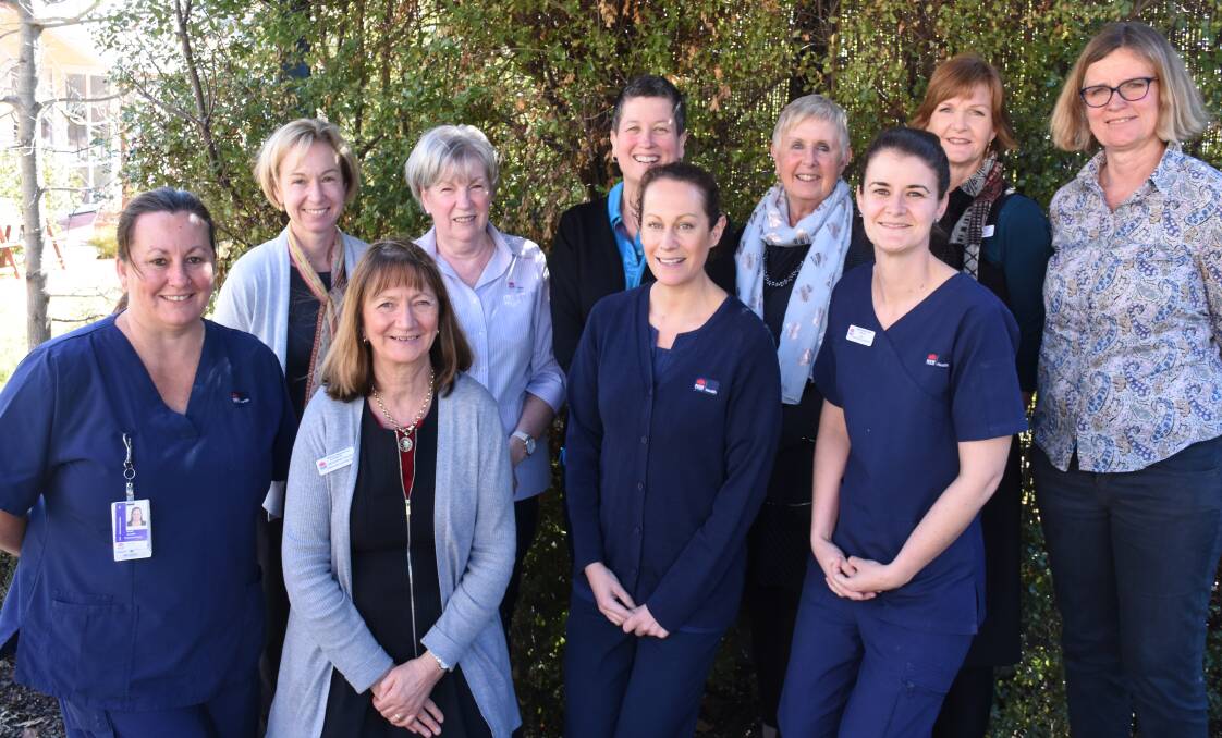 GOT YOUR BACK: Daffodil Cottage specialists (back) Michelle Morgan, Alison Rosser, Victoria Stevens, Jo Young, Mooreen Macley, Tracey Clarke, (front) Nicole Clarke, Elizabeth Gilchrist, Belinda Maynell and Roslyn Cutmore. Photo: NADINE MORTON 080318nmcottage-2