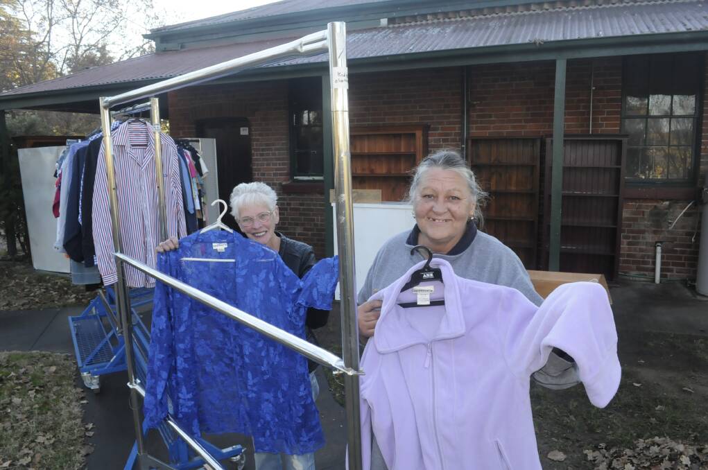 WE'RE BACK: Bathurst Community Op Shop volunteers Marg Price and Linda Baker are helping the store reopen. Photo: CHRIS SEABROOK 061417cshop