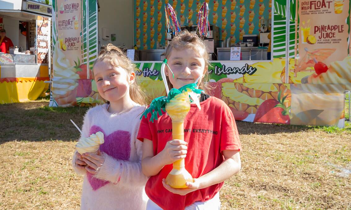 FUN TIMES AHEAD: Faith and Willow Evans enjoying a Dole Whip which is an icecream treat that will be available at the inaugural Bathurst Fun Fair. Photo: SUPPLIED