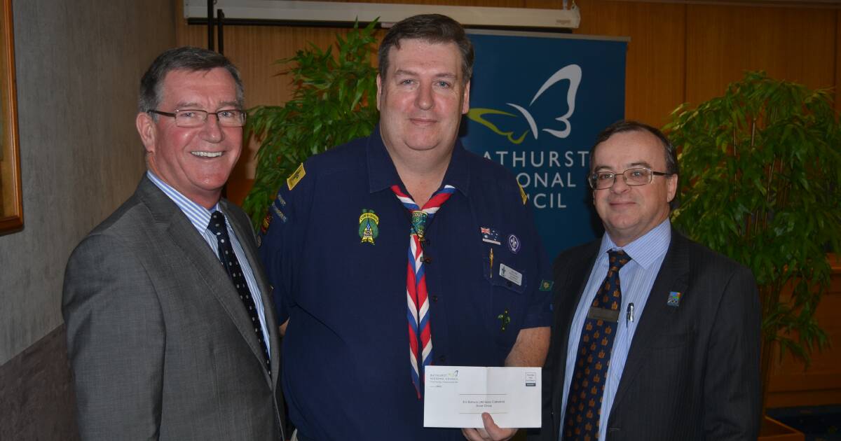 HELPING HAND: 3rd Bathurst (All Saints' Cathedral) Scout Group's Paul Hennessy with Bathurst Regional Council's Gary Rush and Dave Sherley. Photo: NADINE MORTON