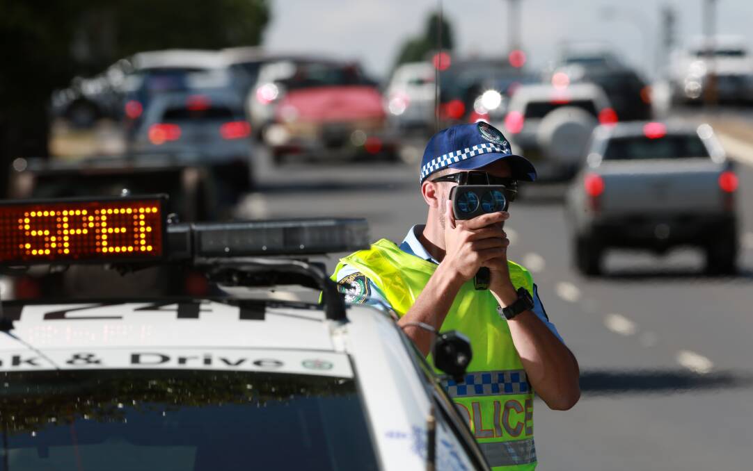 IN OUR SIGHTS: Traffic and Highway Patrol Command Senior Constable Jason Marks  checking motorists' speed in Bathurst. Photo: PHIL BLATCH 122216pbspeed2