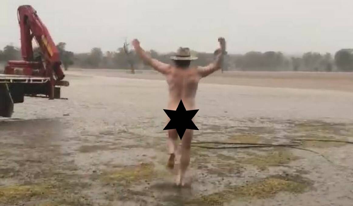 CELEBRATION: Dubbo farmer Glen Bloink stripped off for a 'nudie run' to celebrate rain fall across his drought-stricken property on the weekend. Photo: MIN COLEMAN