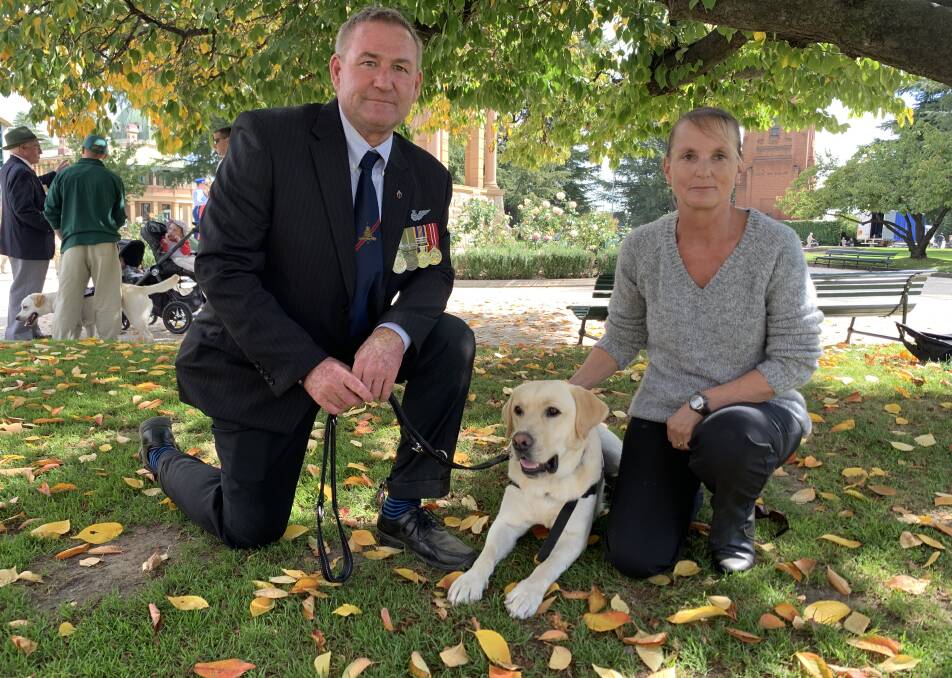 MARCH: Robert Aitken and his assistance dog Gus took part in the march, they are pictured with Robert's wife Bec. Photo: NADINE MORTON 042519nmdog1