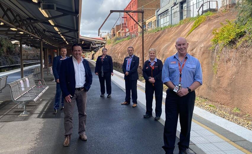 BACK ON TRACK: Bathurst MP Paul Toole, NSW TrainLink director for South West Michael Dorrain, west area manager Tiffany Glasgow, south west associate director Mark Kourouche, Lithgow staff manager Jo Hall and Lithgow station manager Pat Wall. Photo: ALANNA TOMAZIN.
