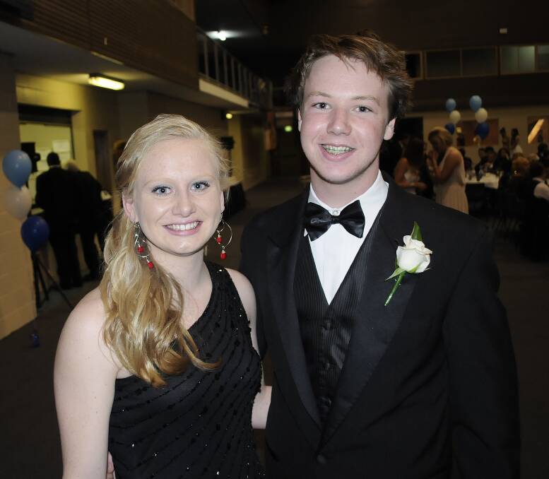 TOUCH OF GLAMOUR: Lauren Dove and Tom Evans were among those who enjoyed the grad. 	092113cssc16