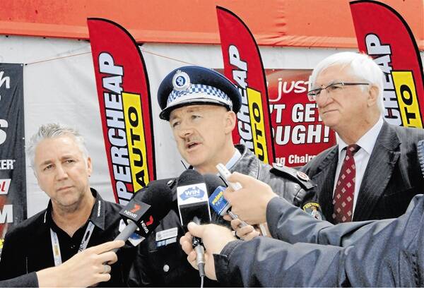 UNITED FRONT:  V8 Supercars chief operating officer Shane Howard, Operation Vintage commander Assistant Commissioner Alan Clarke and Member for Bathurst Gerard Martin are pleased the Bathurst 1000 has become a family friendly attraction.  Photo:  PHILL MURRAY  100710ppolice