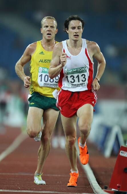 STRIDING OUT: CSU graduate Ben St Lawrence (back) follows Christopher Thompson of England in the men’s 10,000 metres final at Jawaharlal Nehru Stadium during day nine of the Delhi 2010 Commonwealth Games. Photo: GETTY IMAGES 101210lawrence