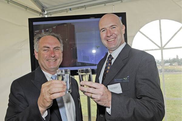THAT IS FRESH: Sustainability and urban water parliamentary secretary Senator Don Farrell and mayor Greg Westman enjoy a glass of clean, clear water at the filtration plant yesterday. Photo: PHILL MURRAY  020312pwater1