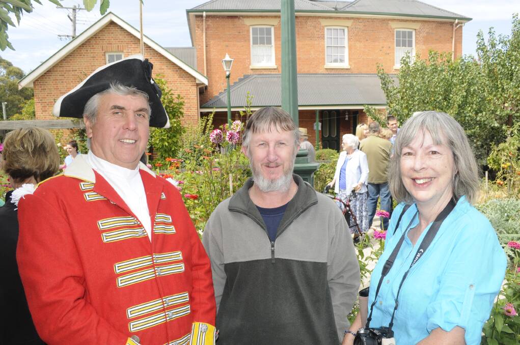 LOVING HERITAGE: Jeff McSpedden with Len and Christine Riding got into the swing of things at the Old Government Cottage. 032915cottge4