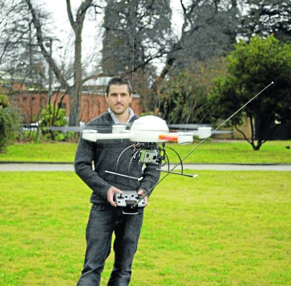 NEW HEIGHTS: Bathurst man Kendall Plummer has been flying his microdrone over the region for the past four months; he is preparing to launch his aerial photography business, Aerial Exposure. Photo: Brian Wood 040711microdrone