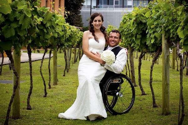 WEDDING BELLS: Kurt Fearnley swapped Olympic rings in favour of wedding rings when he married Sheridan Rosconi at Newcastle on Saturday.  Photo: Silver 7 Photography 121310kurt2