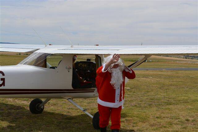 SNAPPED: Santa recently visited the Bathurst Aero Club Christmas party. Santa arrives at Bathurst!