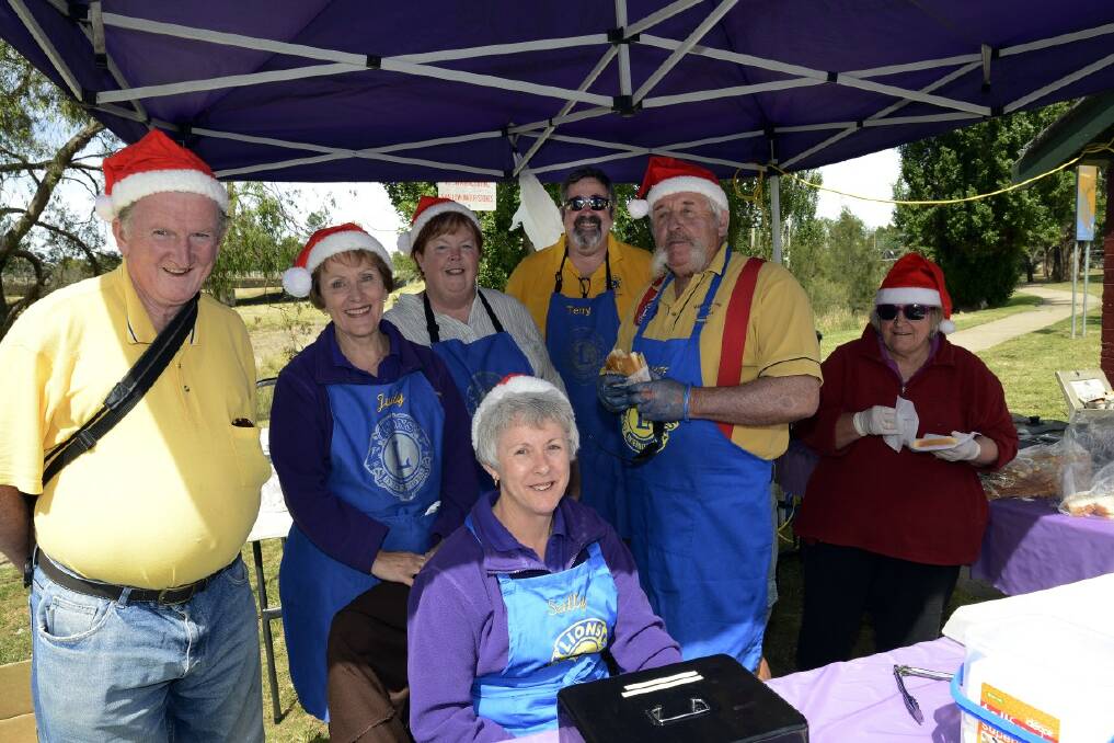 SNAPPED: Bathurst Macquarie Lions Club members getting ready for the Twilight Markets. 120713plions2