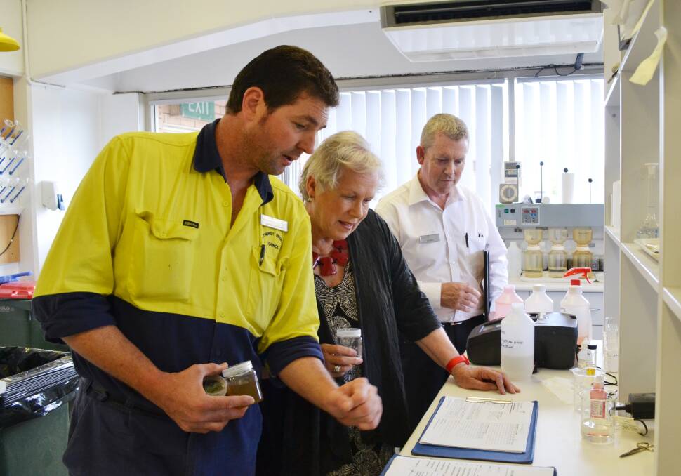 CLEARWATER: Bathurst Regional Council's water filtration plant supervisor David Cashen with mayor Monica Morse and water and waste manager Russell Deans checking on the progress of manganese removal trials. Photo: ZENIO LAPKA 	121212zwater4