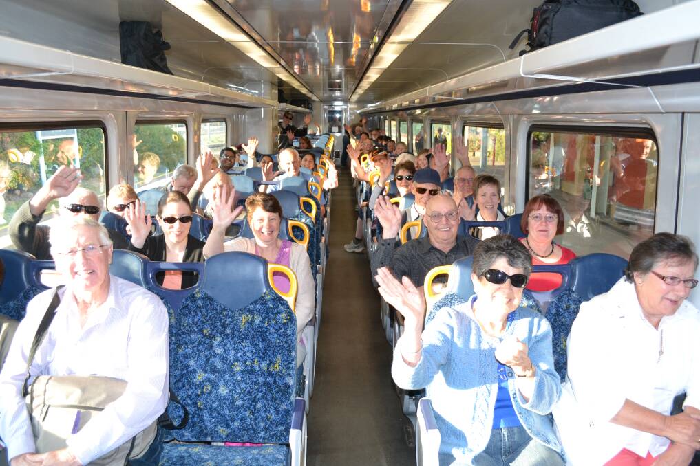 DAY TRIPPERS: A carriage full of day trippers on board the Bathurst Bullet for yesterday's debut of the new service.102112train10