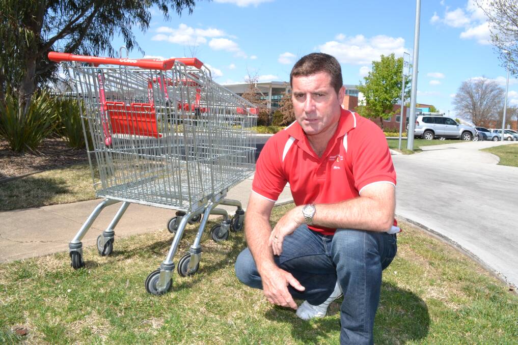 TRUCK LOAD OF TROLLEYS: Councillor Warren Aubin agrees that shopping trolleys in Bathurst should be fitted with locks to stop them being removed from supermarkets. Photo: BRIAN WOOD092612trolley1
