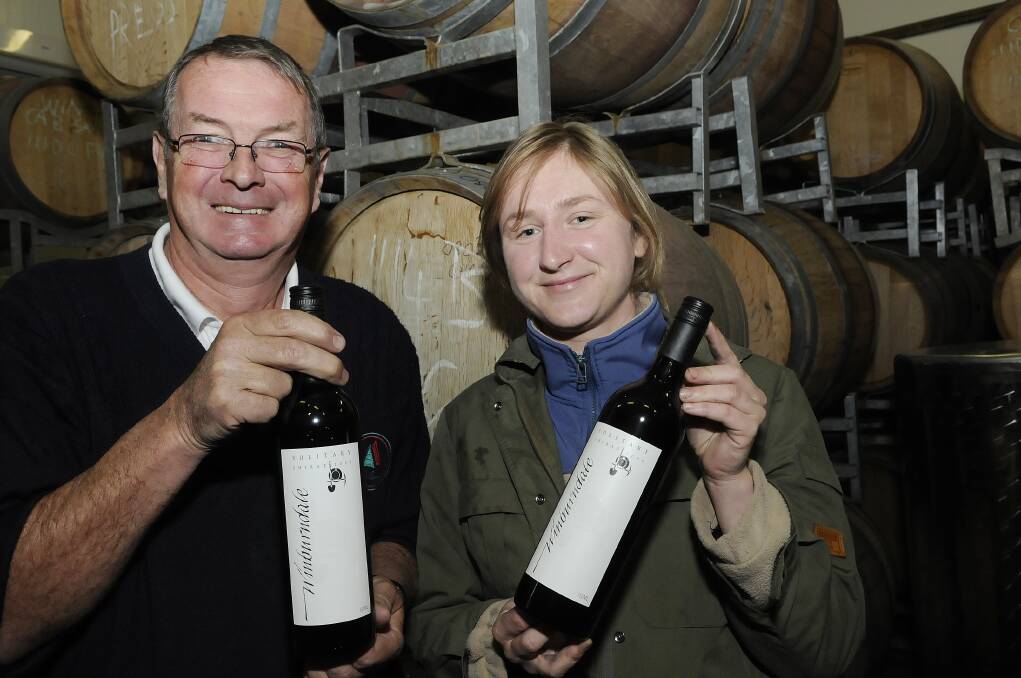 TOP DROP: Winburndale Wines’ Mike Burleigh and German winemaker Cordula Von Junkes with a couple of bottles of the award-winning Solitary Shiraz 2009. Photo: PHILL MURRAY 082312pwine