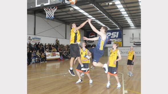 2009: : Students from Orange and Bathurst high schools do battle in the boys’ basketball match.