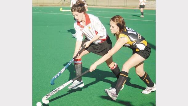 2008: Orange's Rebecca Waters (right) pressures Dubbo’s Candy Garraway in their Astley Cup match.