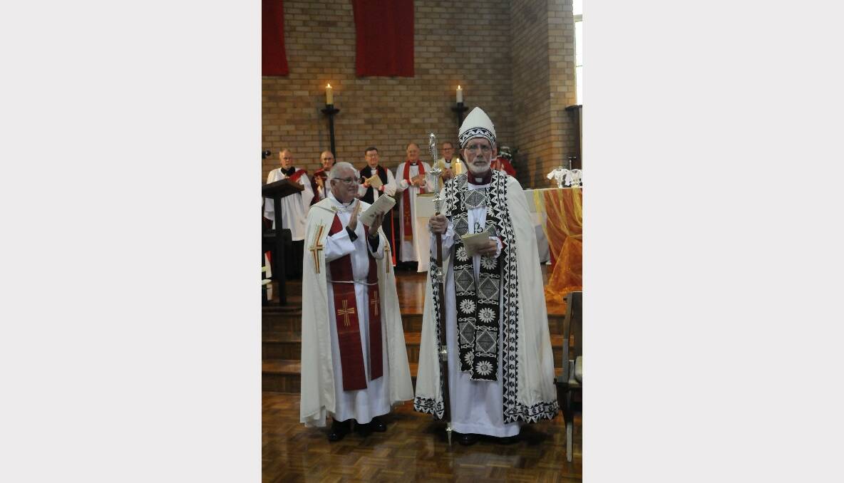 The administrator of the Bathurst Diocese Frank Hetherington (left) presents the newly installed 10th Bishof Bathurst Ian Palmer. Photo: PHILL MURRAY