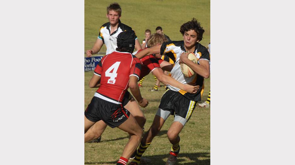 2010: Orange High's Clancy Currie is contained by the Dubbo defence in their Astley Cup rugby league tie.